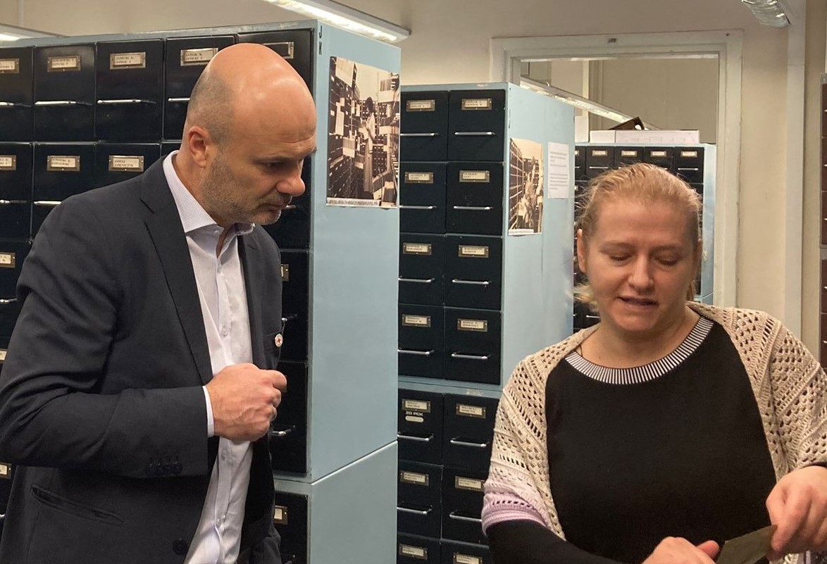 Katarzyna Kubicius, head of the Protecting Family Links team at the Polish Red Cross, and Dursan Vujasanin, Head of CTA Bureau, at the Polish Red Cross WWII archives in Warsaw.